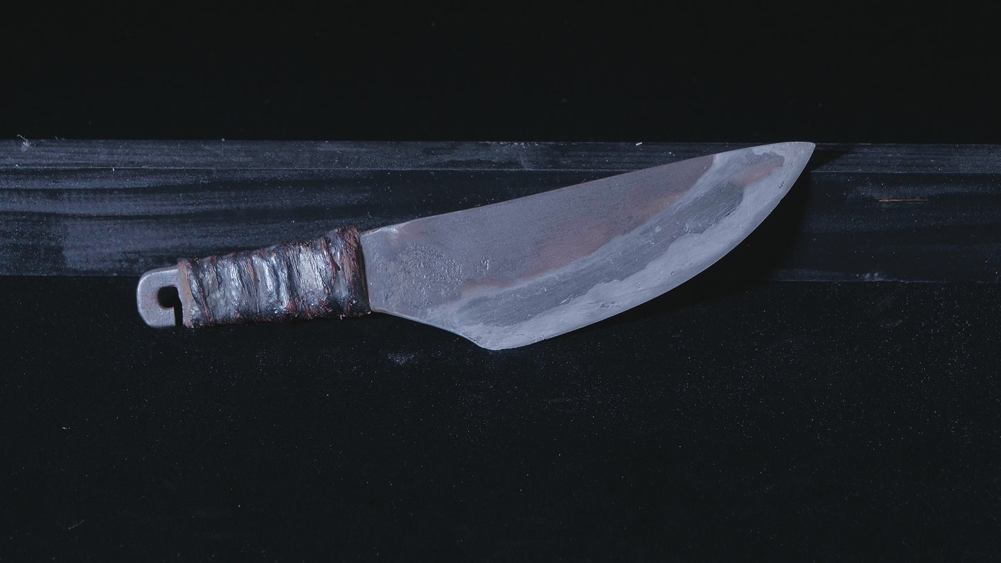 Knife with chained weight