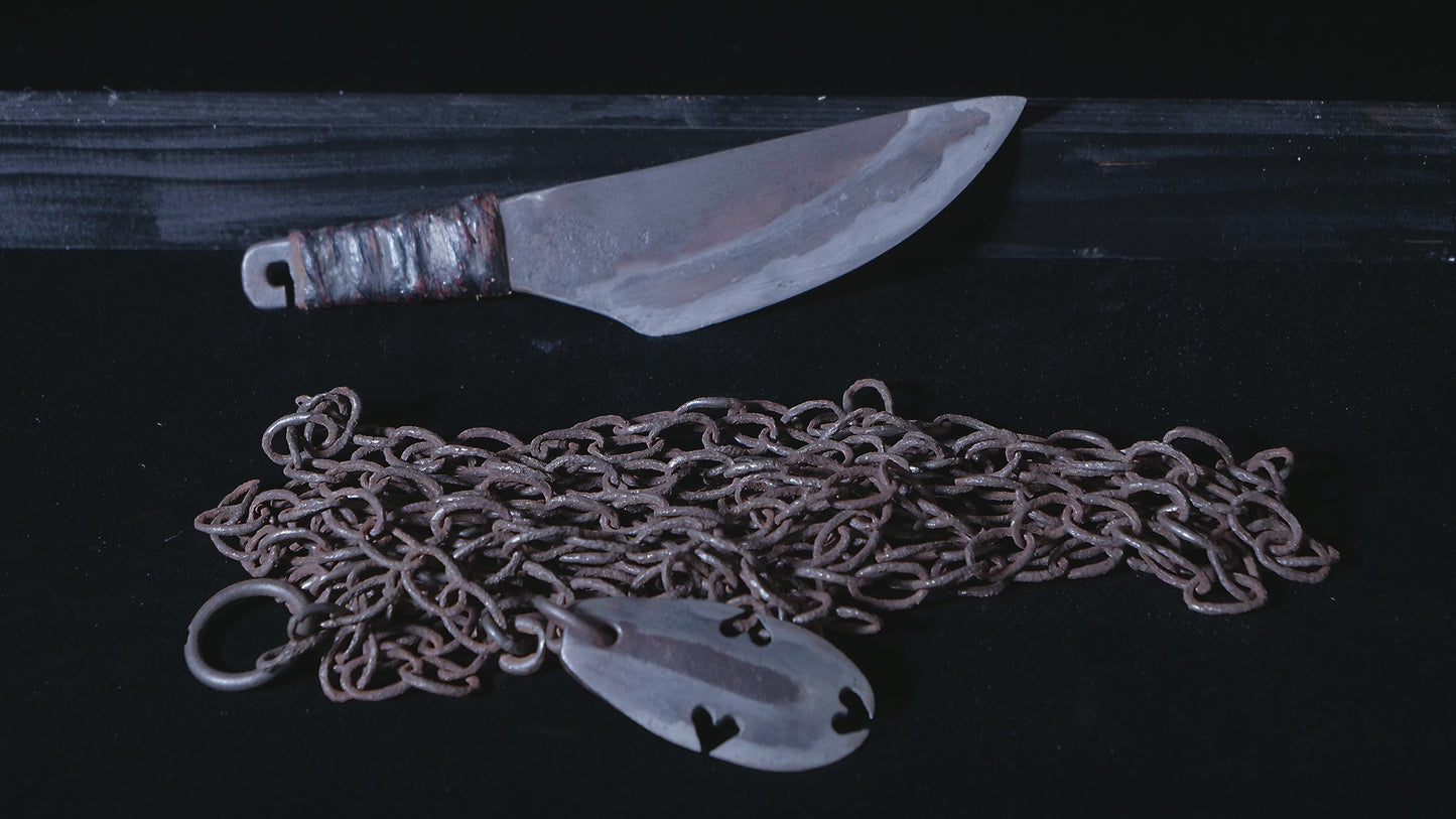 Knife with chained weight