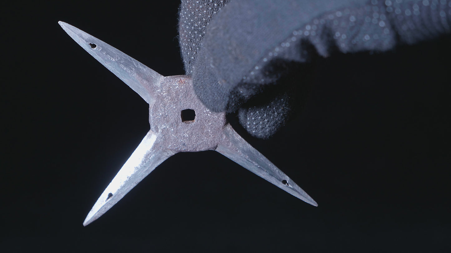 Cross-shaped ninja star (shuriken)