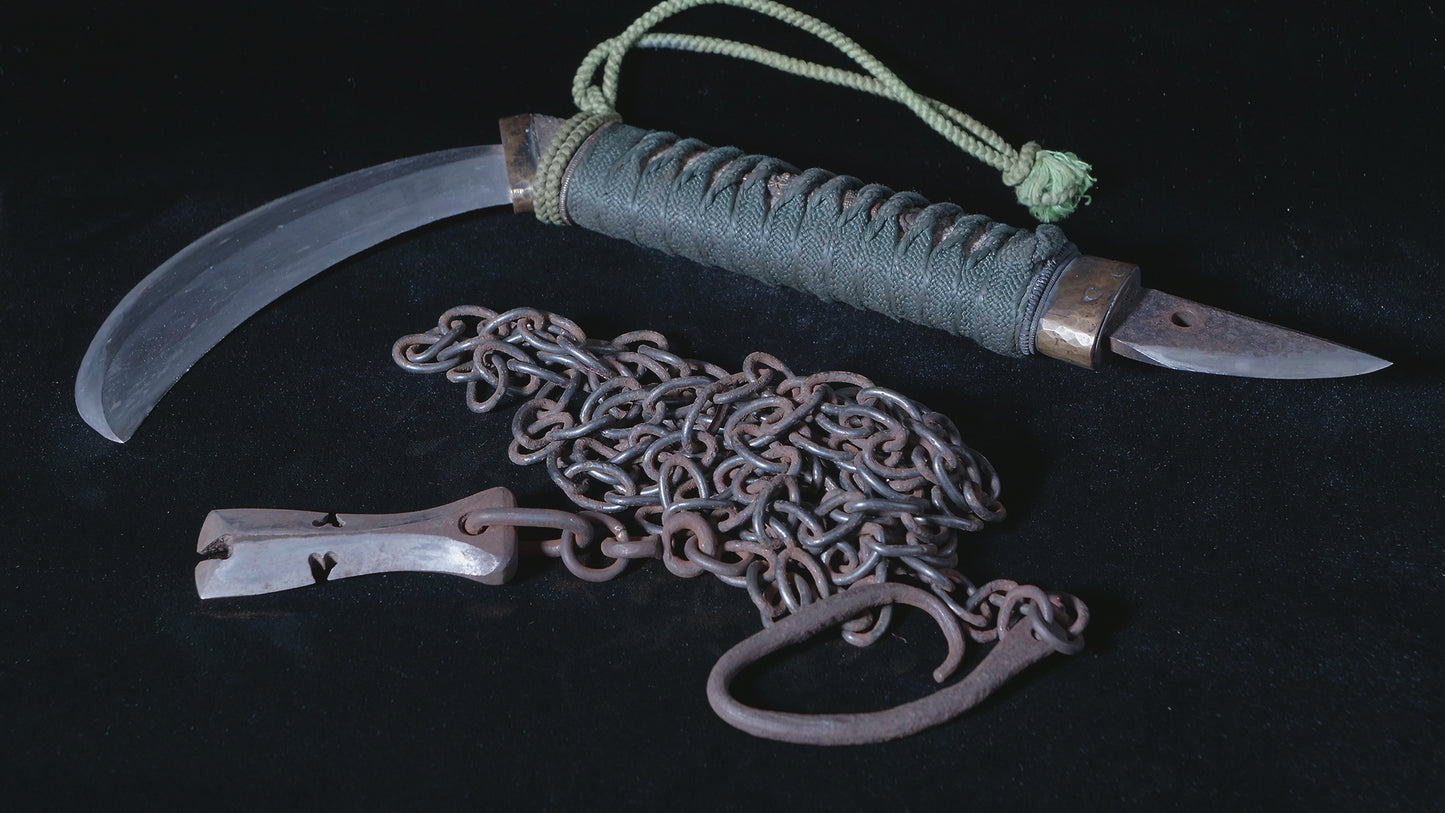 Sickle with knife and chained weight